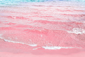 Foamy Rippled Clear Sea Wave Rolling to Pink Sand Shore Turquoise Blue Water. Beautiful Tranquil Idyllic Scenery. Tropical Beach Vacation Relaxation Paradise. Copy Space Elegant Styled Toned Image