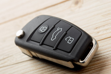 Car key and security remote on the table, concept for rent or buy a new car