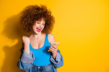Portrait of her she nice crazy cute lovely winsome glamorous charming attractive cheerful cheery wavy-haired girl yes get notification isolated over bright vivid shine yellow background
