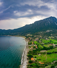 Amos Ancient city landscape. Kumlubuk beach, sea and mountain. Beauty in nature. Marmaris, Mugla, Turkey. Holiday and summer background. Lycian way.