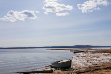 The spring river waiting for a high water in a midland of Russia in the clear sunny day.