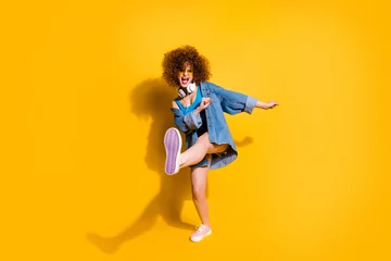 Foto op Canvas Full length body size photo funny she her lady wavy styling curls clubber strange moves wear headset ear flaps specs casual jeans denim shirt shorts tank top clothes isolated yellow background © deagreez