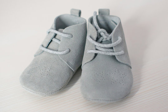Isolated pair of blue suede leather baby shoes, cute children lace-up soft sole footwear, toddler's fashionable clothing and accessories, shopping ideas for baby showers or as gift for the little ones