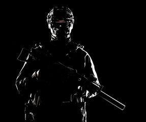 Naklejka premium SWAT officer with service rifle low key portrait