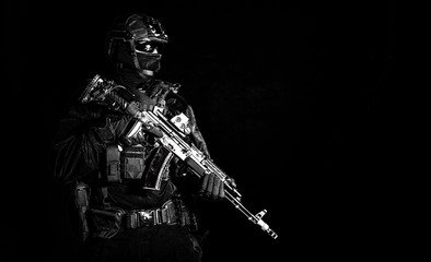 Equipped elite forces soldier low key portrait
