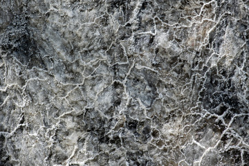 Fototapeta na wymiar Salzgestein mit Einschlüssen, Sand Mineralien und Salzkristalle, Rohstoff für die Salzgewinnung