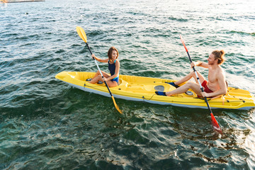 Sporty young couple kaying together