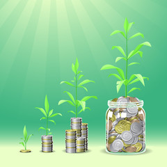 Coins stacks with a plants growing on the top.