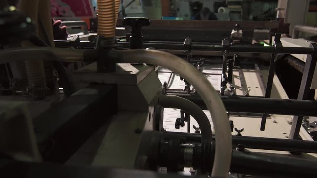 The Employee Of A Large Industrial Printing House