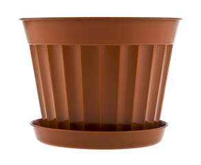 Brown plastic flower pot isolated on white background close up.