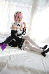 Portrait of Japan anime cosplay woman , white japanese maid in white tone room