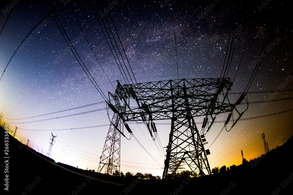 Wall mural the outline of the power supply facilities and stars at night