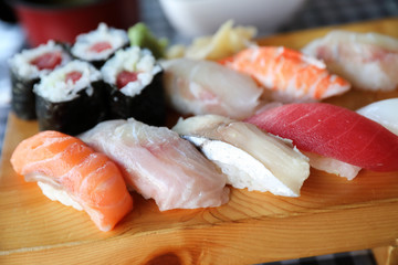 Sushi Set nigiri and sushi maki with tea served on wood and soup , Japanese food