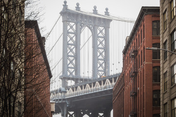 The famous view of the Manhattan bridge at Dumbo in the streets of Brooklyn - New York City, NY