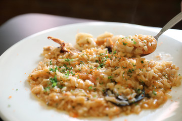 Seafood Risotto , traditional italian rice on table