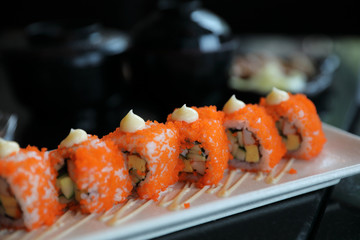 california roll sushi , rice roll with egg avocado egg and fish japanese food