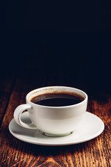 White cup of black coffee