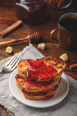 Stack of french toasts with berry marmalade
