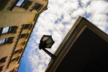 House with a lantern on a background of clouds