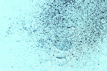 Vintage blue background. Rough painted wall of sapphire color. Imperfect plane of blue colored. Uneven old decorative toned backdrop of cyan tint. Texture of sapphirine hue. Ornamental stony surface.