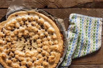 Freshly baked cheesecake on a wooden background. View from directly from above