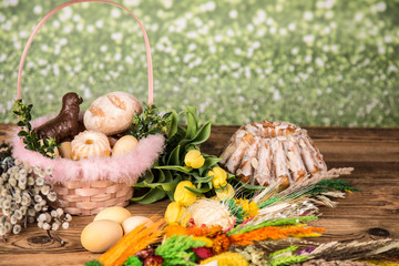 Easter. Colorful palms and base. Foods for Easter candles. Eggs and basket. Easter cake