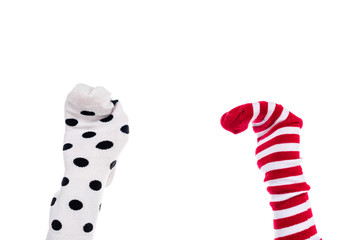 cropped view of person with colorful sock puppets on hands Isolated On White