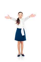 happy schoolgirl in formal wear with outstretched hands on white