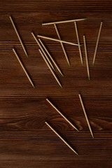 Toothpicks are loose on a wooden table