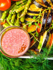 Assortment of Raw Vegetables, tomato sauce, olive oil bottle