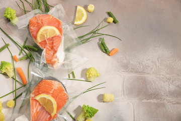 Sous Vide cooking concept. Vacuum packed ingredients arranged on light background.