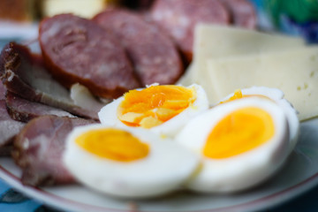 Homemade food from grandmother. Sausage, cheese, boiled eggs. Breakfast at Easter.Ukrainian folk cuisine