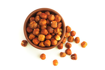 bowl full of hazelnuts isolated on a white background