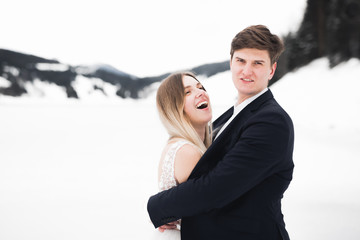 Sensual portrait of a young wedding couple. Outdoor