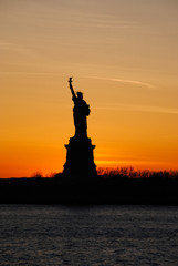 Amazing view of the Statue of Liberty, at sunset © raulhernaizcao
