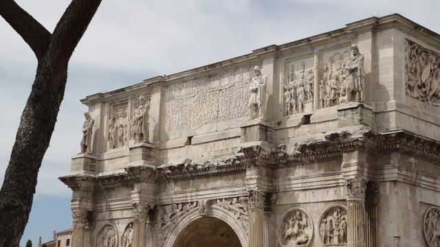 Arch of Constantine near the Colosseum. Rome. Detail of relief sculptures of the Constantine arch covered in white marble.