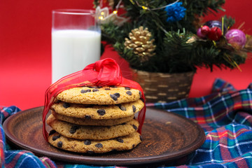 A glass of milk and cookies for Santa. Christmas Eve Concept.