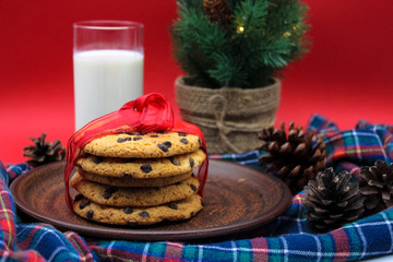 A glass of milk and cookies for Santa. Christmas Eve Concept.