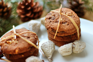 Christmas decorations - oat biscuits for Santa Claus and branches of coniferous trees