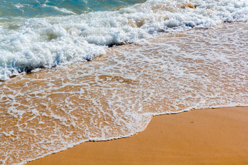 Fototapeta na wymiar Calm Waves in The Beach