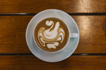 cup of coffee on wooden table