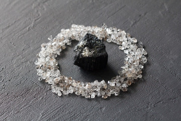 Scattered diamonds on a black background. Raw diamonds and mining, a scattering of natural diamond...
