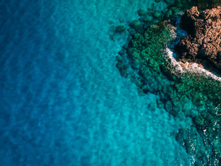 Aerial Rocky sea shore with crystal clear blue water, Cyprus, Blue Lagoon