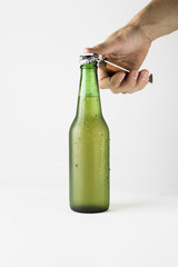 Hand opening beer bottle