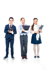 Fototapeta premium smiling schoolchildren with clipboards pretending to be businesspeople On White