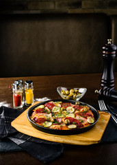 pan with roasted meat and vegetables