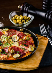 pan with roasted meat and vegetables
