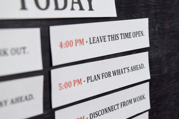 Close up making agenda Daily schedule on personal organizer. Business and entrepreneur concept. Isolated on black background