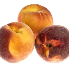 Three ripe juicy peaches