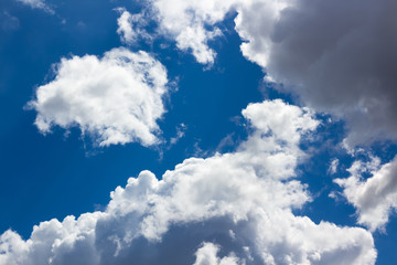 Obraz premium White fluffy clouds in the blue sky
